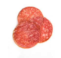 chopped pieces of salami on a white plate