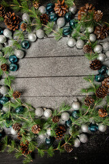 Christmas frame background with copy space. Merry Christmas and Happy New Year banner with tree balls and pine cones.