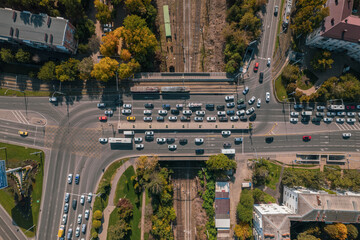 Drones point of view - traffic jam top view, transportation concept, intersection crossroad aerial view from above. Road traffic on crossroad or intersection downtown.