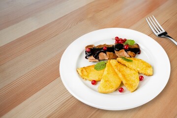 Tasty fresh hot dish and salad on the plate