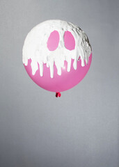 pink balloon with white paint