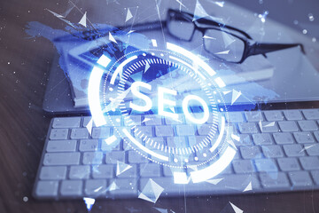 Double exposure of SEO drawing and cell phone background. Concept of data search optimization