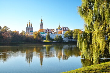 Fototapeta na wymiar Autumn view of the Novodevichy Monastery and the Great Novodevichy Pond in Moscow, Russia