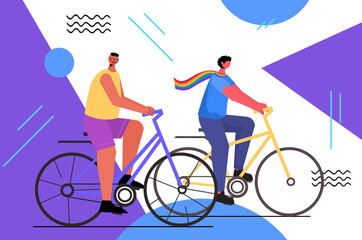 gay couple riding bicycles LGBT parade pride festival transgender love concept full length