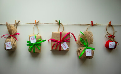 Handmade Advent calendar with gifts wrapped in natural materials.