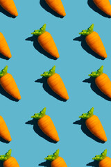 Pattern from small carrots on a blue background.
