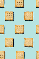 Crackers pattern on a blue background. View from above.