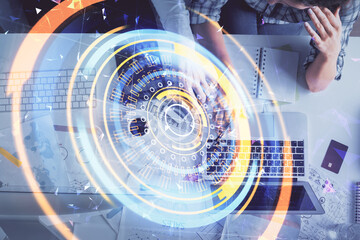 Double exposure of man and woman working together and technology theme drawing. Computer background. Top View. High tech concept.