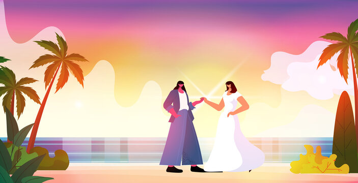 Newlywed Lesbian Couple Walking On Beach Transgender Love LGBT Community Wedding Celebration Concept