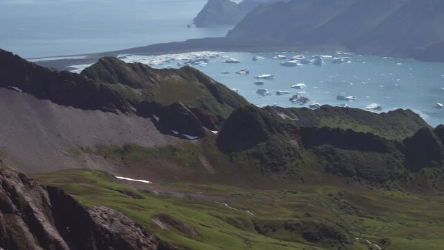 Aerial of Bear Glacier Lagoon and icebergs at the end of a fjord in Kenai Fjords National Park, Alaska