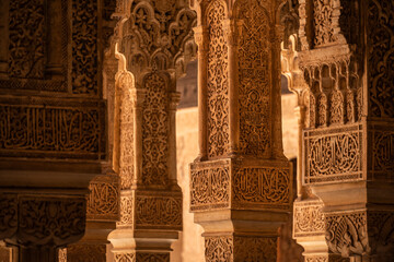Moorish ornaments at the entrance of the Palace of the Lions (Palacio de los Leones, Sala de los Mocárabes), Nasrid palaces, Alhambra de Granada UNESCO World Heritage Site, Andalusia, Spain - obrazy, fototapety, plakaty