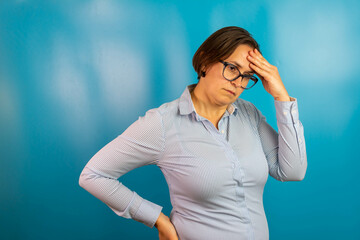 hopeless woman suffering from depression having nervous breakdown holding her head on isolated background, copy space. Depressed woman feeling lonely tired and worried suffering depression.