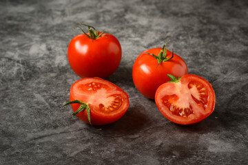 organic italian red tomato on the gray background - closeup