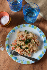 brown rice with chopped tomatoes and parsley - closeup