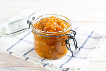 Spicy sauce from yellow plums, garlic, hot pepper, cilantro, dill and mint, known as tkemali. Georgian cuisine. Preserving