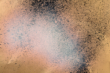 spray white and black on golden paper