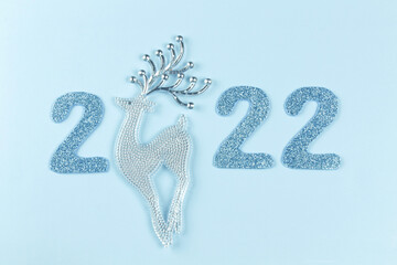 New year or christmas concept. New year number 2022 on a blue background