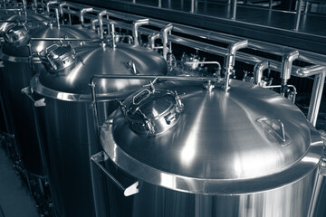 Modern brewery production steel tanks and pipes, machinery tools and vats, beer production