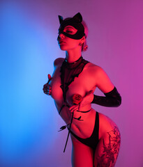 sexy woman in leather cat mask and leather rose for bdsm sex toys