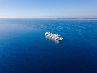 Aerial view on cruise liner in the blue sea