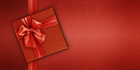 merry christmas gift card with gift red box with ribbon and bow, isolated on red background, top...