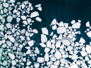Ice floes on the water surface of the lake. Aerial top down view. Baikal lake, Siberia, Russia....