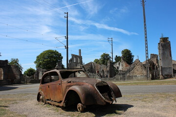 Old timer vehicle in Oradour sur Glane ,historic site of massacre, France