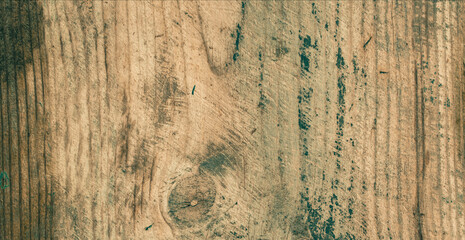 The texture of an old wooden board with paint residue