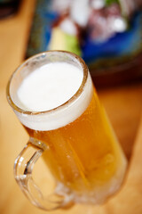 glass of beer with foam
