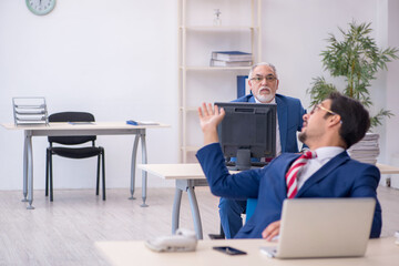 Two male colleagues working in the office