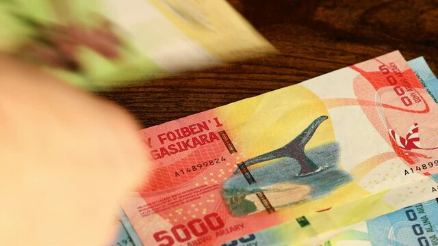 Money from Madagascar counted and put on the table