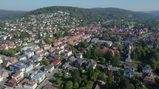 Aerial around the city Büdingen in Germany, hesse on a sunny morning in summer.