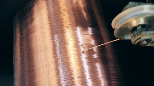 Revolving spool with newly-produced copper wire on it