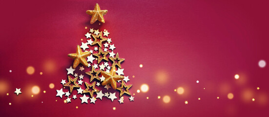 Christmas and New Years red background with Christmas Tree made of golden and wooden stars.