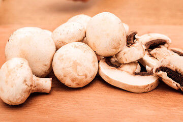  Fresh champignons lie on a cutting board