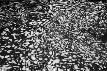 abstract pattern of foam on water