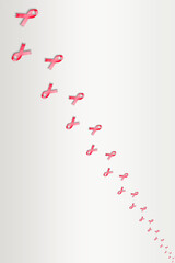 Small red ribbons on grey background representing World AIDS day