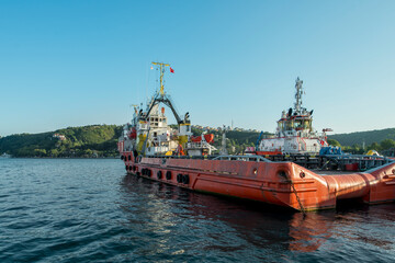 Fototapeta premium Tugboats moored on the shore of the Bosphorus channel north of Istanbul