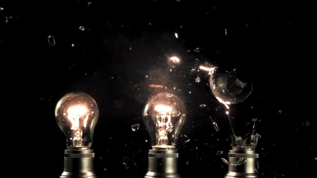 Super slow motion light bulb exploded. On a black background. Filmed on a high-speed camera at 1000 fps.High quality FullHD footage