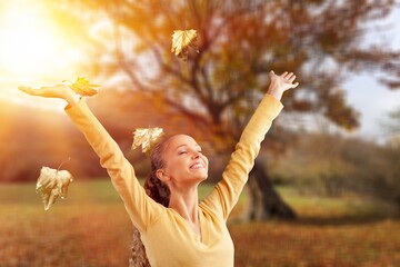 Hello september. happy trendy woman having fun time outdoors in the city park in autumn.