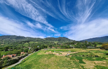 Fototapeta na wymiar Rural landscape with blue sky in Loma Del Escobero. Envigado, Antioquia, Colombia.