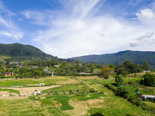 Fototapeta na wymiar Rural landscape with blue sky in Loma Del Escobero. Envigado, Antioquia, Colombia.