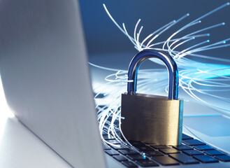 Padlock protecting laptop from computer virus represented by optical fibers