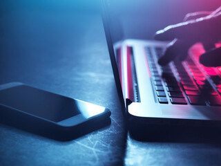 A man working on laptop at night