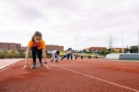 Children in starting postion, preparing for a race