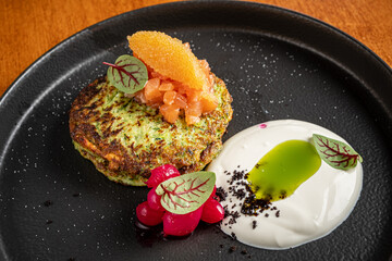 broccoli pancakes with salmon and sauce