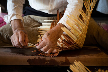 Japan, Takayama, Craftsman making baskets in workshop