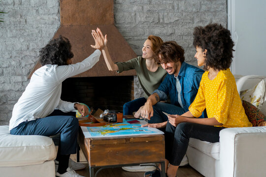 Friends meeting to plan vacations, checking map