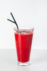 red smoothie on the white background