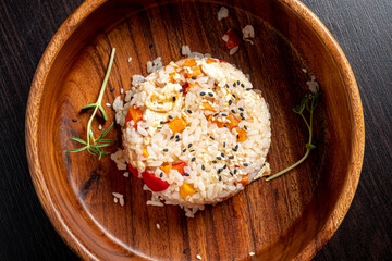 rice with vegetables in the wooden bowl